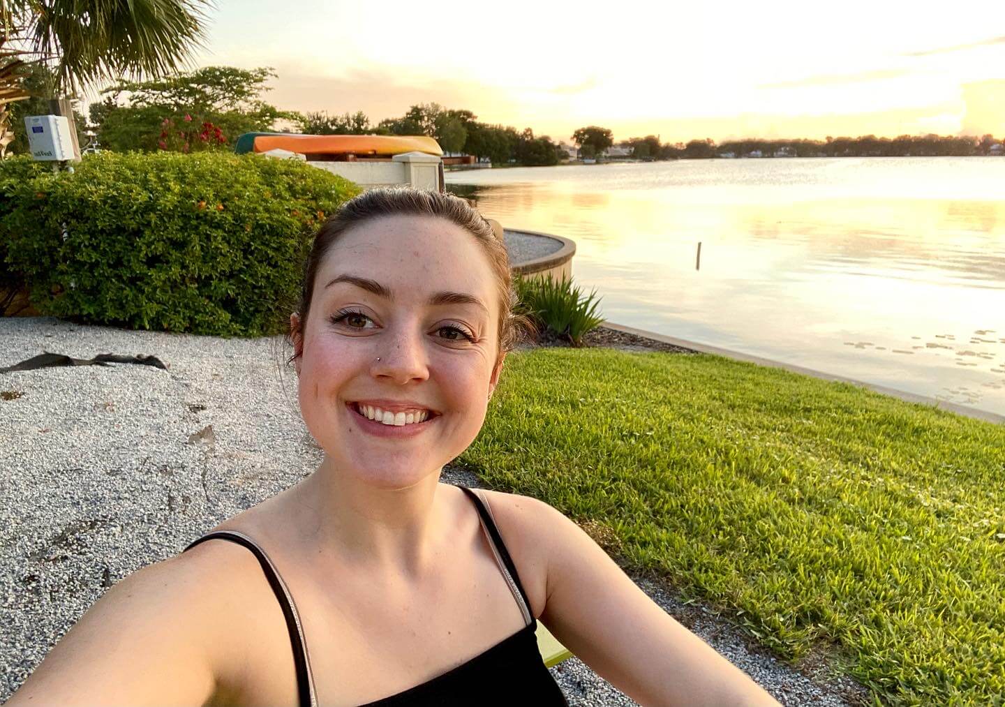 Hannah enjoys taking s lakeside selfie...
