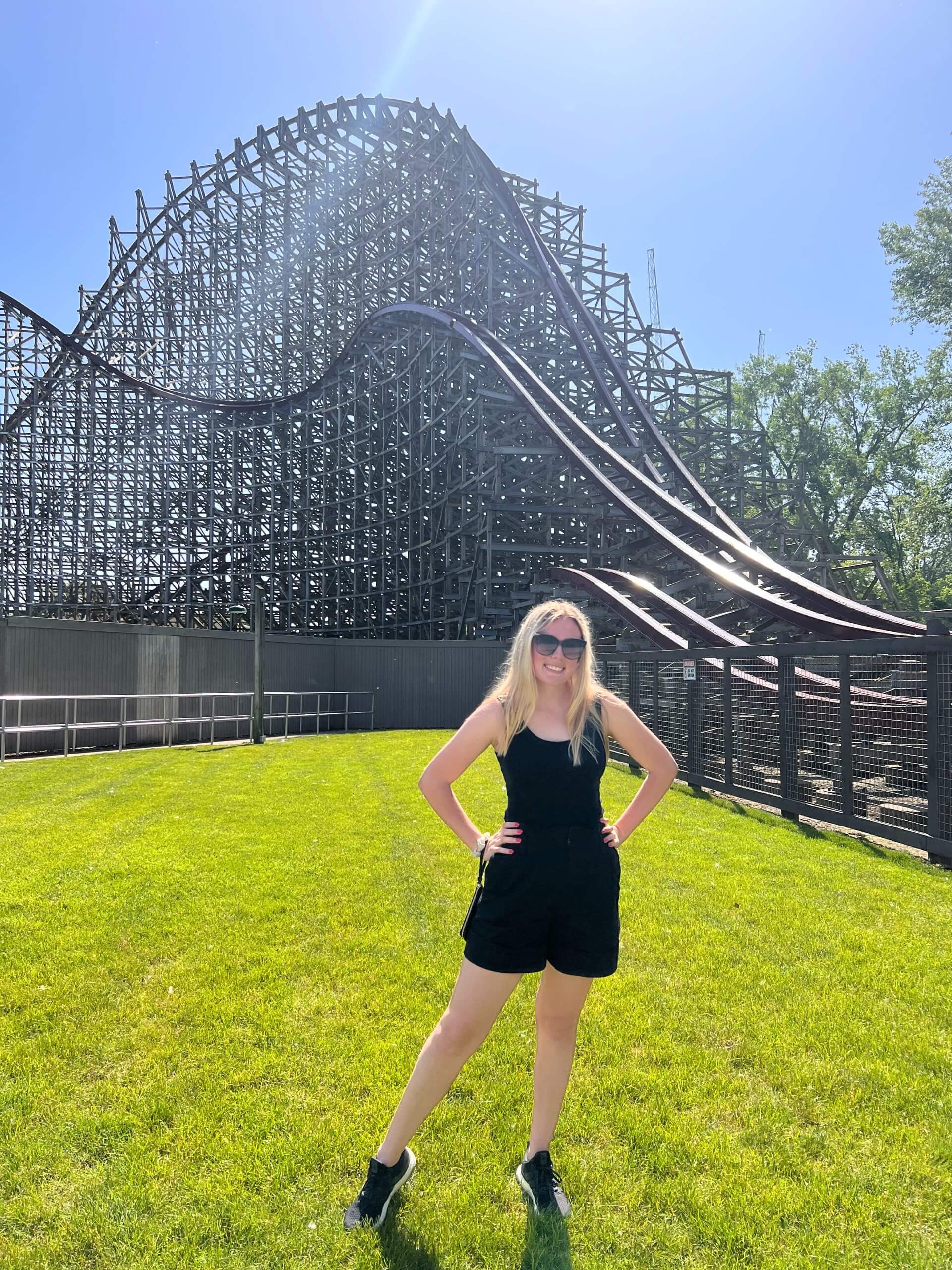 Courtney standing in front of her favorite roller coaster