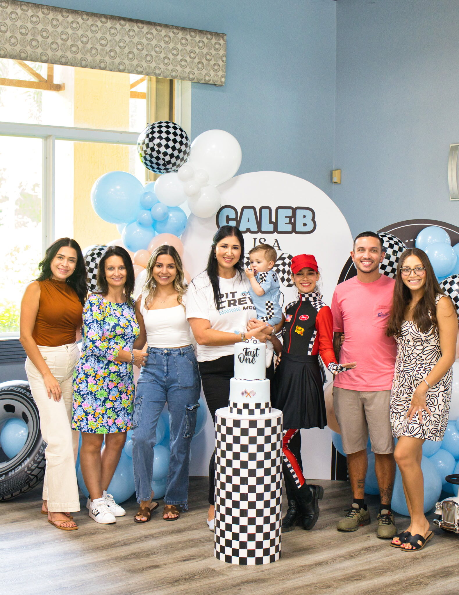 Sam with her family and girlfriend at a birthday party for Caleb