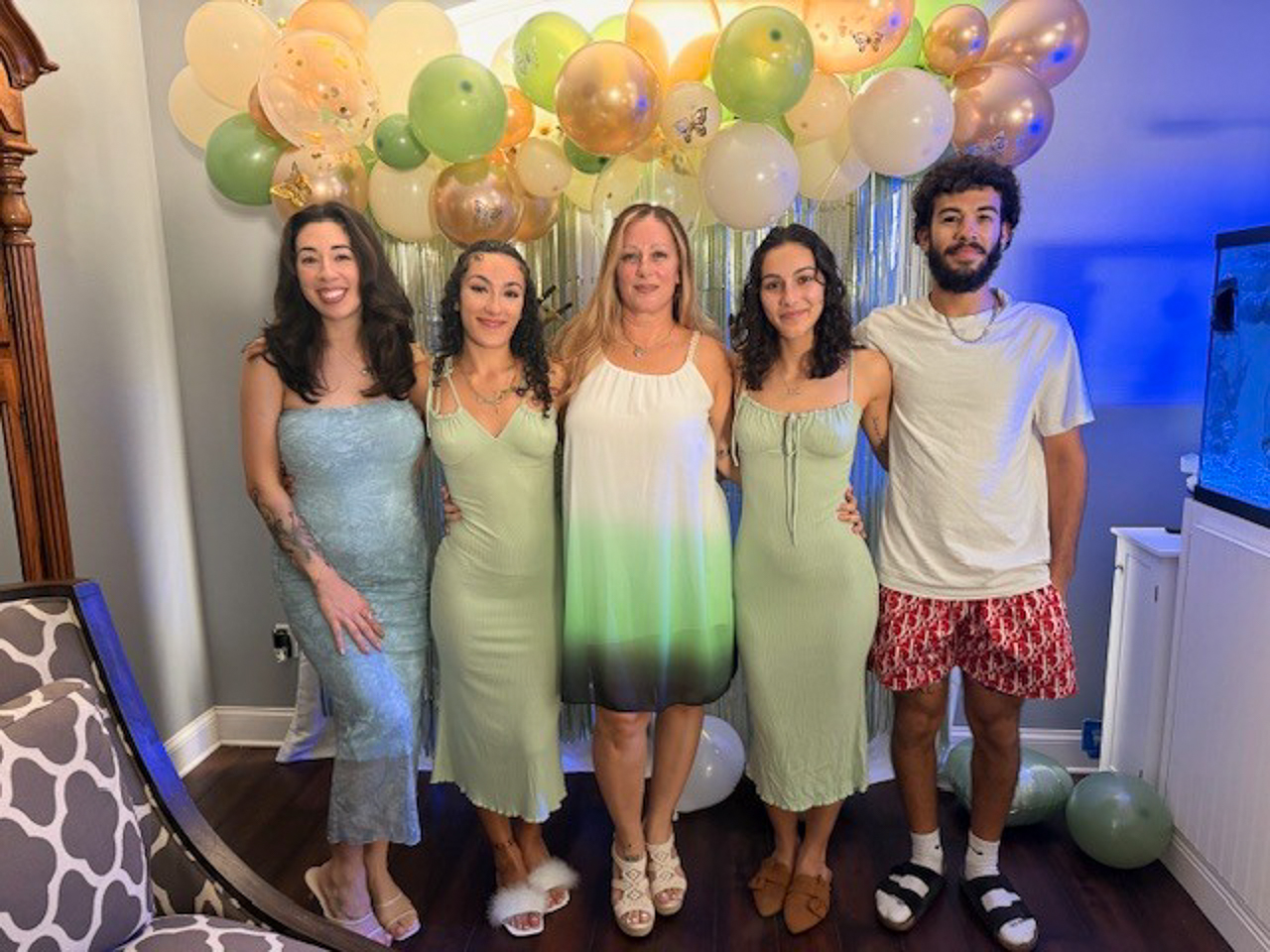 Connie stands in the middle of a group photo