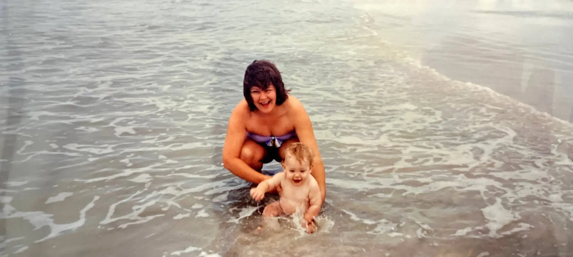Brad Lyn as a baby with mother