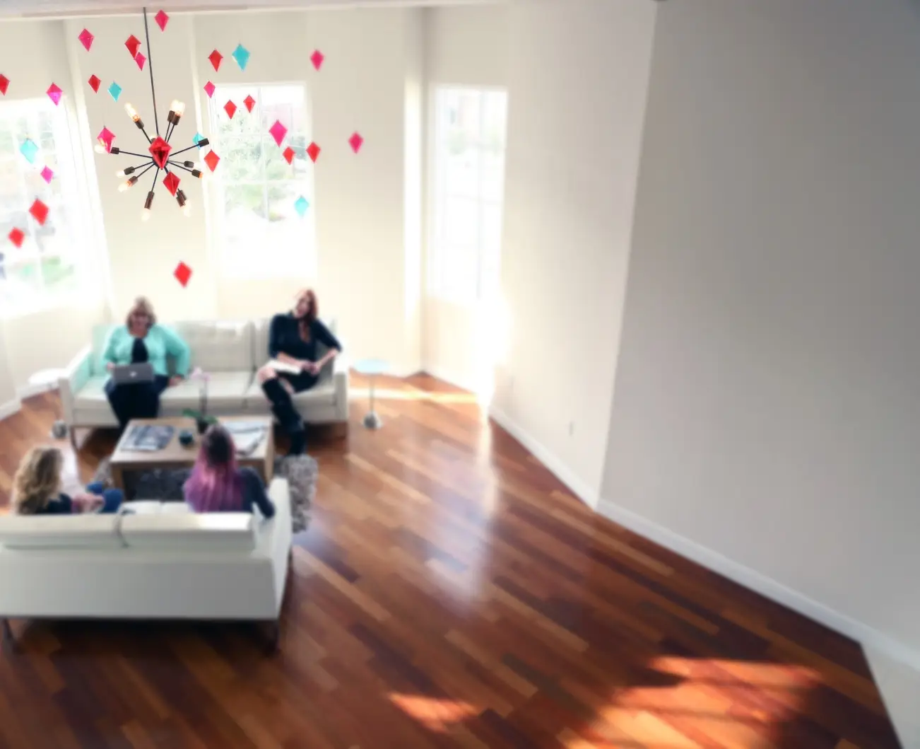 team members sitting on a couch working together
